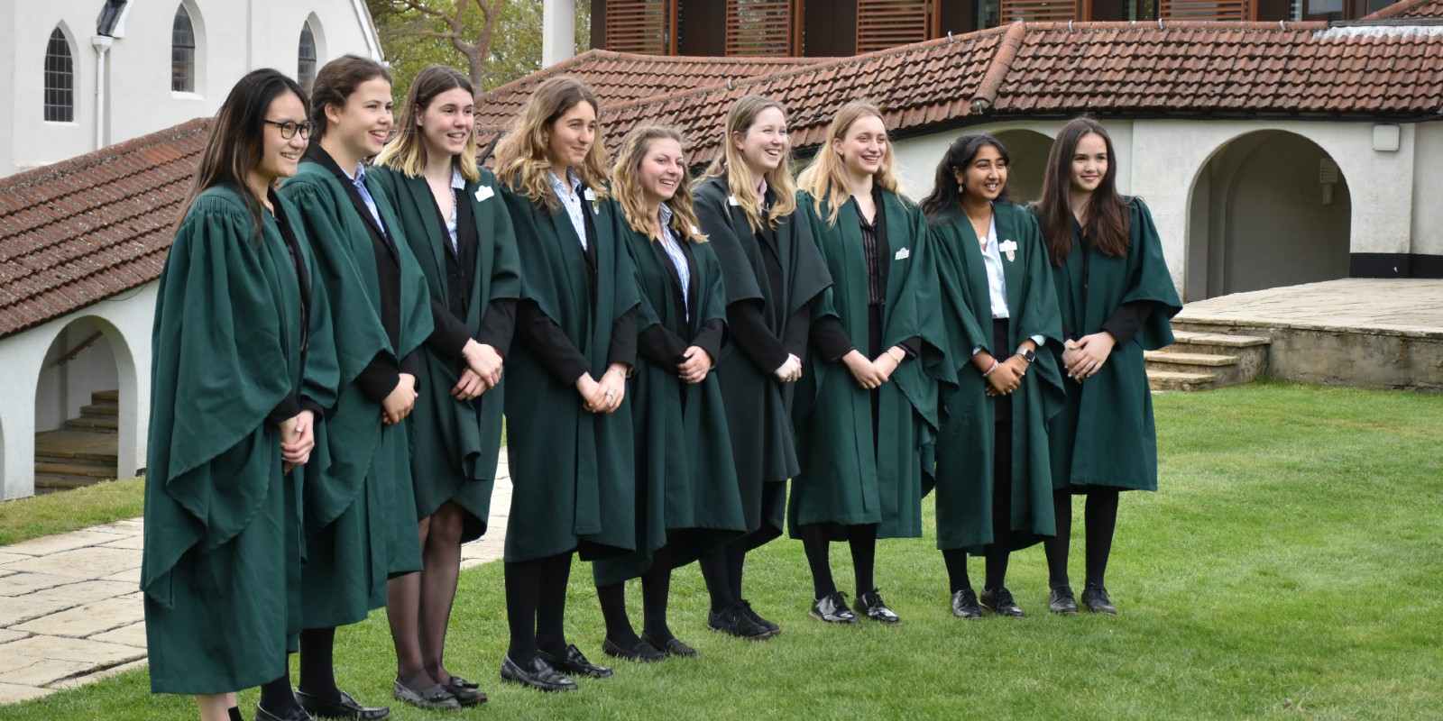 Downe House Ambassadors in gowns in cloisters group shot