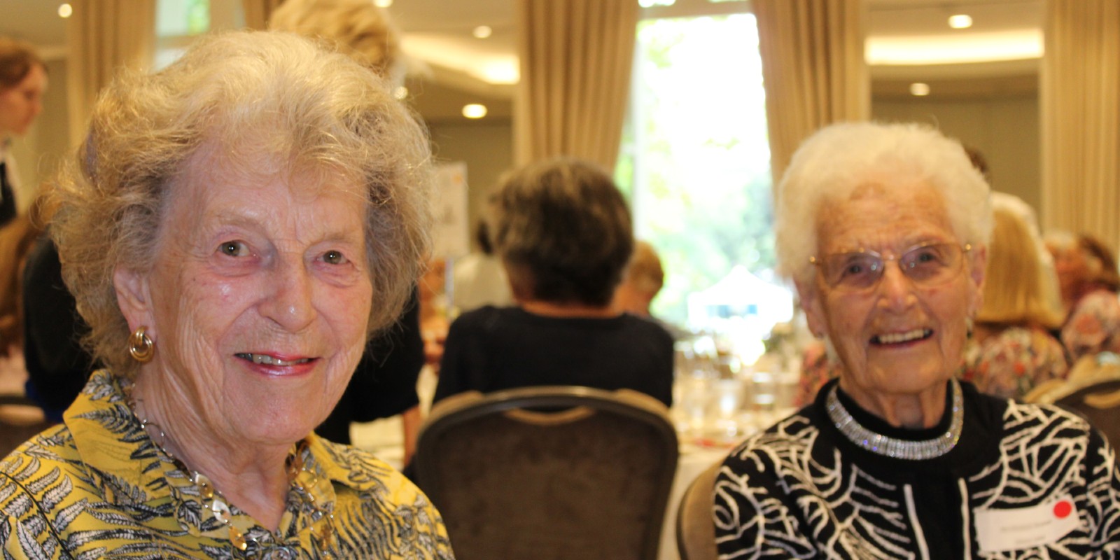 Two Downe House Seniors smile at the camera