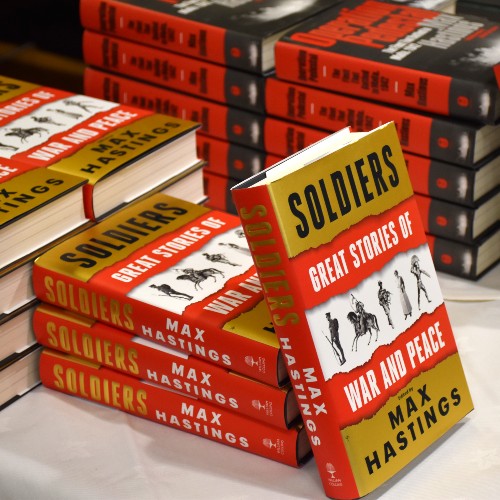 Sir Max Hastings 'Soldiers' Book on a stand with more books