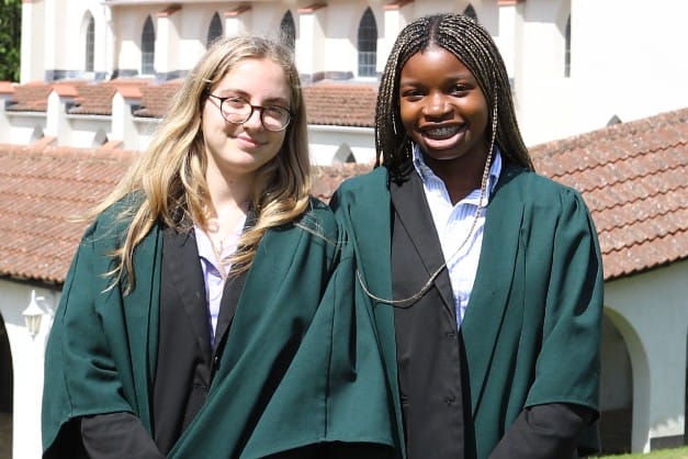 Head and Deputy Head Senior Ebunlola and Cléo smile at the camera